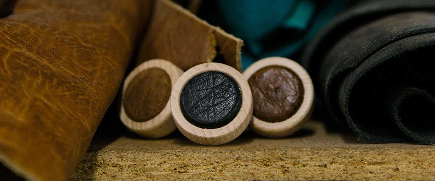 Three leather bottle caps.